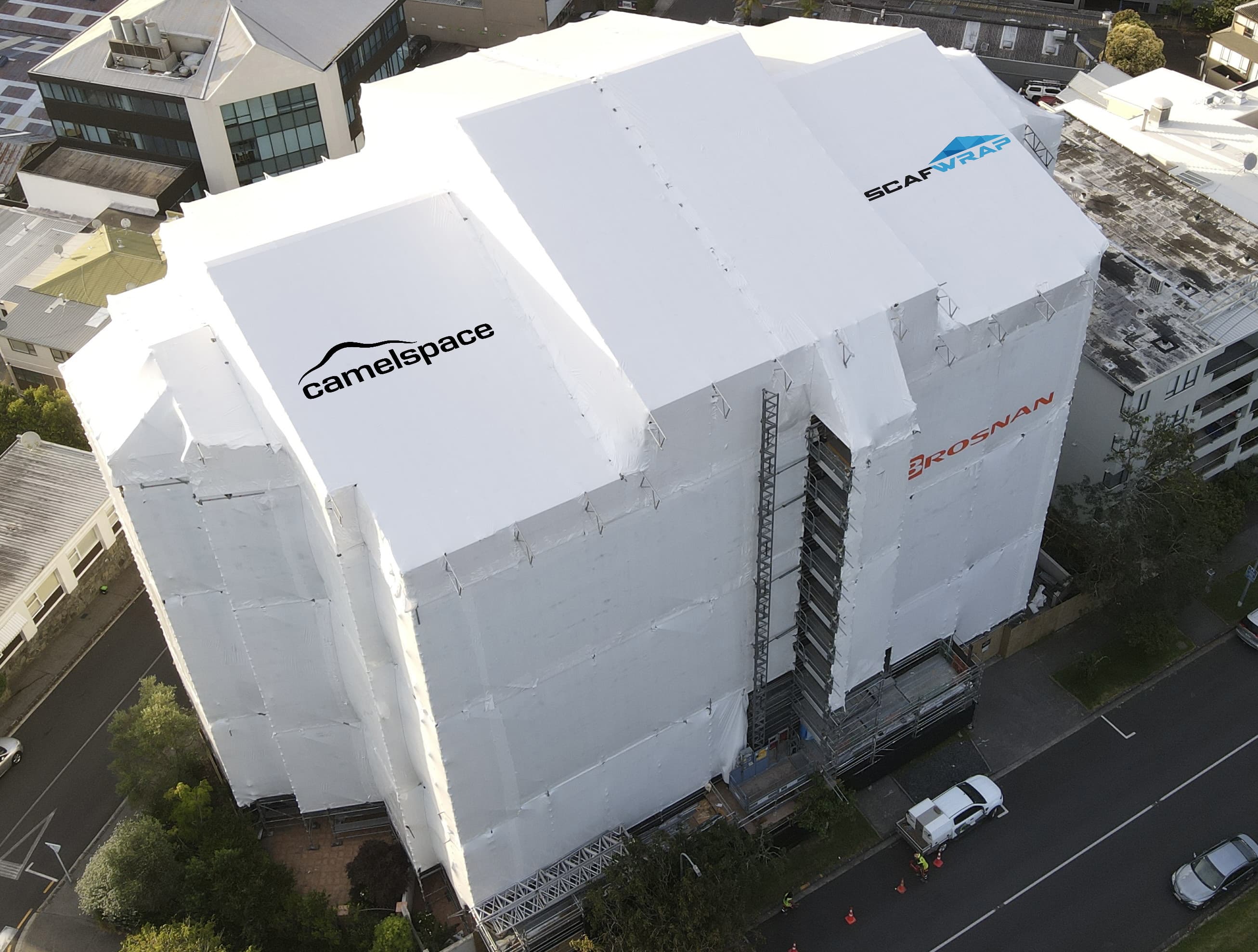 Shrink wrap weatherproofing on scaffolding at a construction site in Auckland, New Zealand
