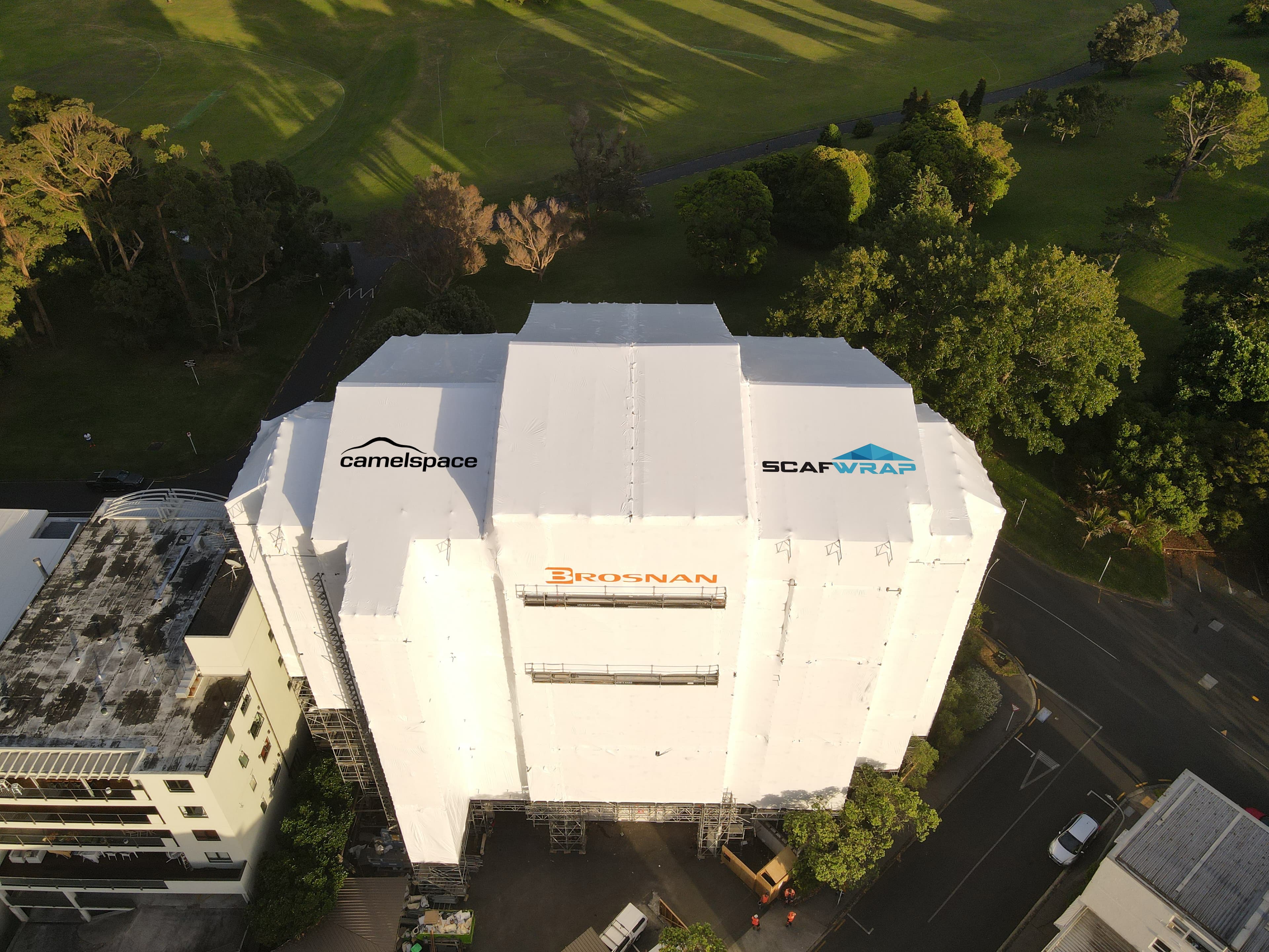 Shrink wrap weatherproofing on scaffolding at a construction site in Auckland, New Zealand
