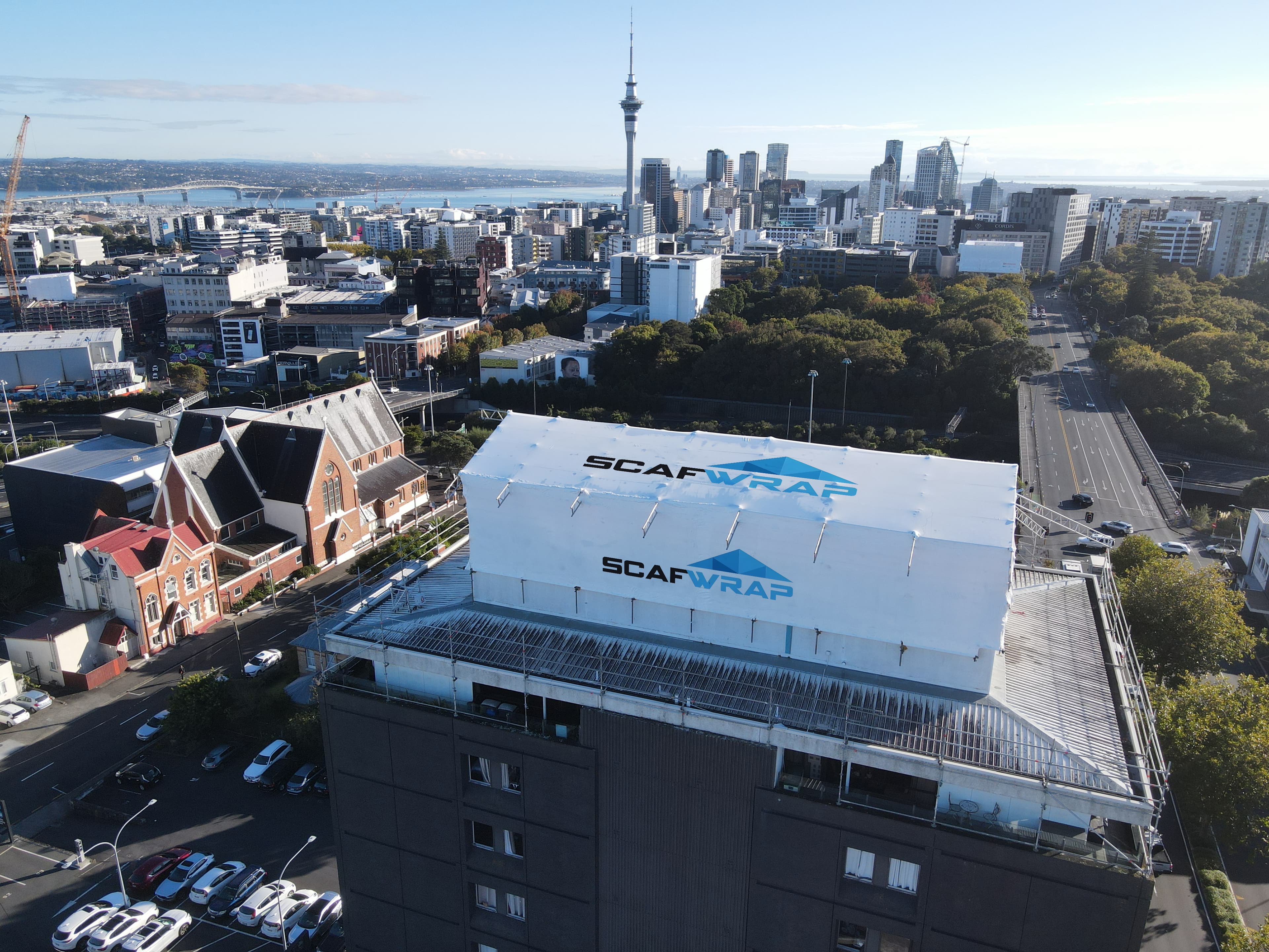 Shrink wrap weatherproofing on scaffolding at a construction site in Auckland, New Zealand