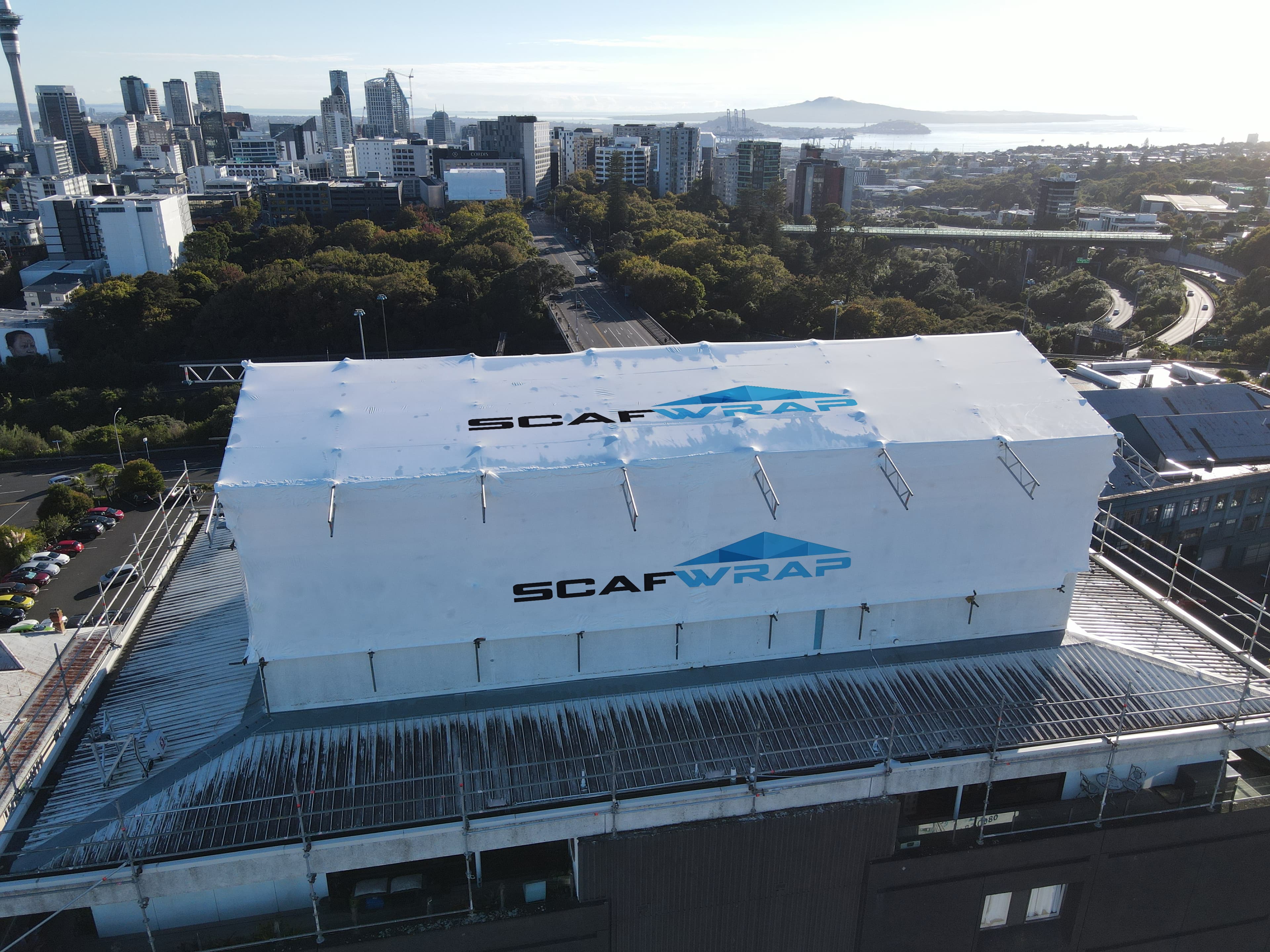Shrink wrap weatherproofing on scaffolding at a construction site in Auckland, New Zealand