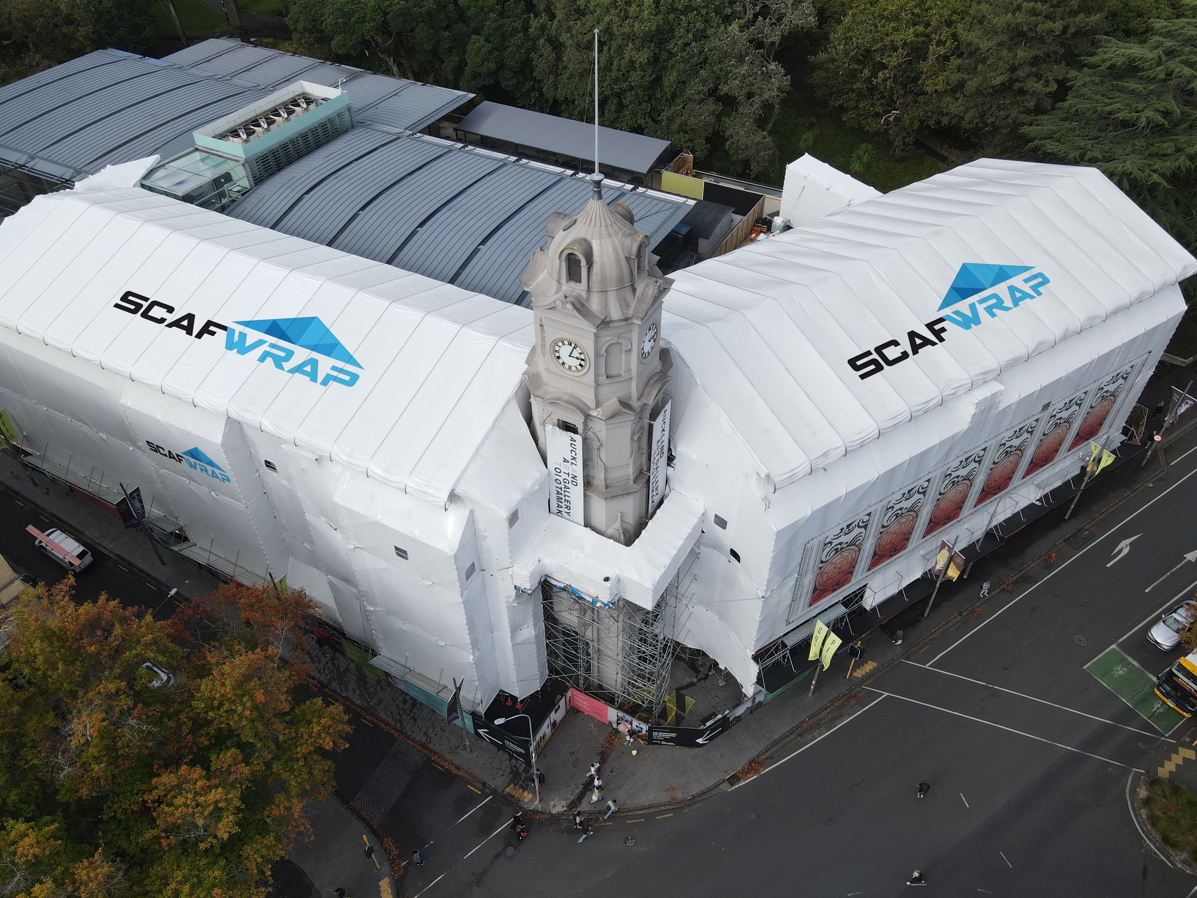 Residential building recladding project with weatherproof shrink wrap in Auckland