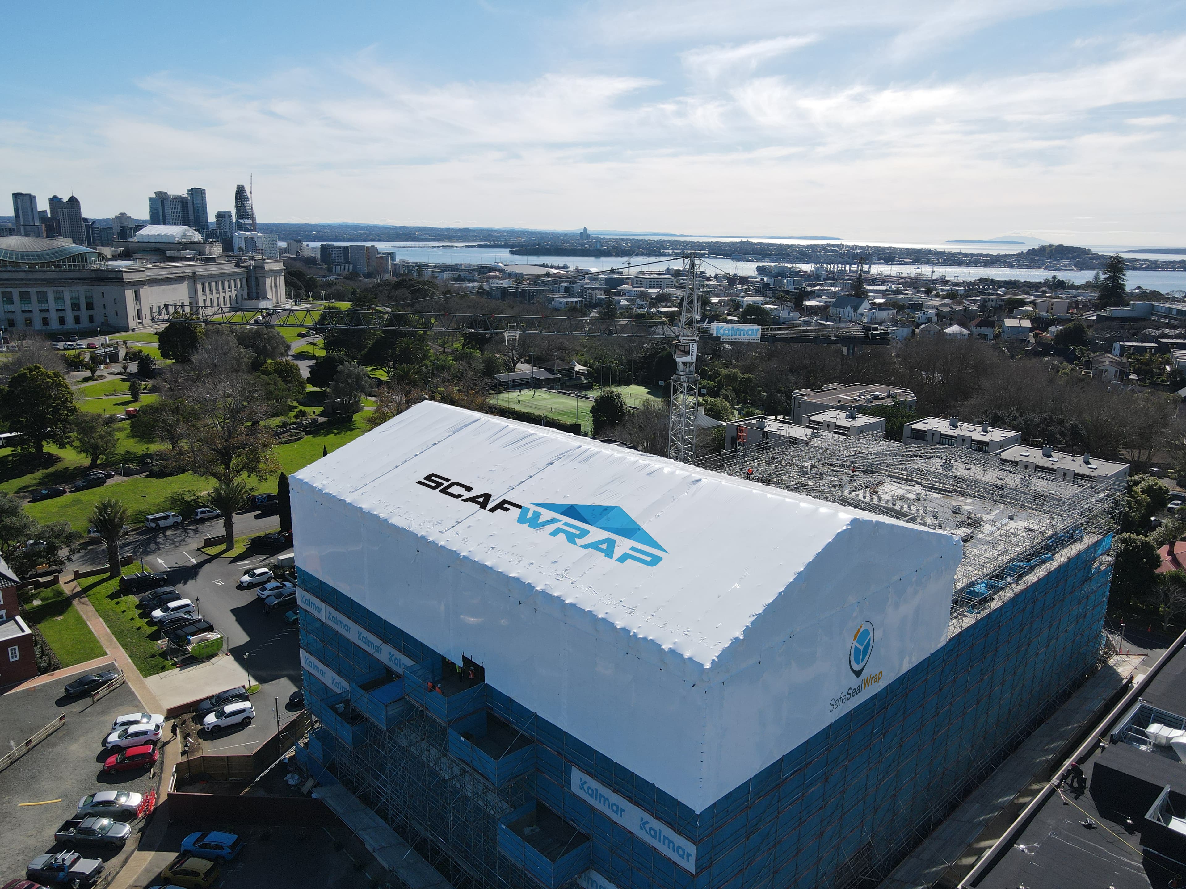 Residential building recladding project with weatherproof shrink wrap in Auckland