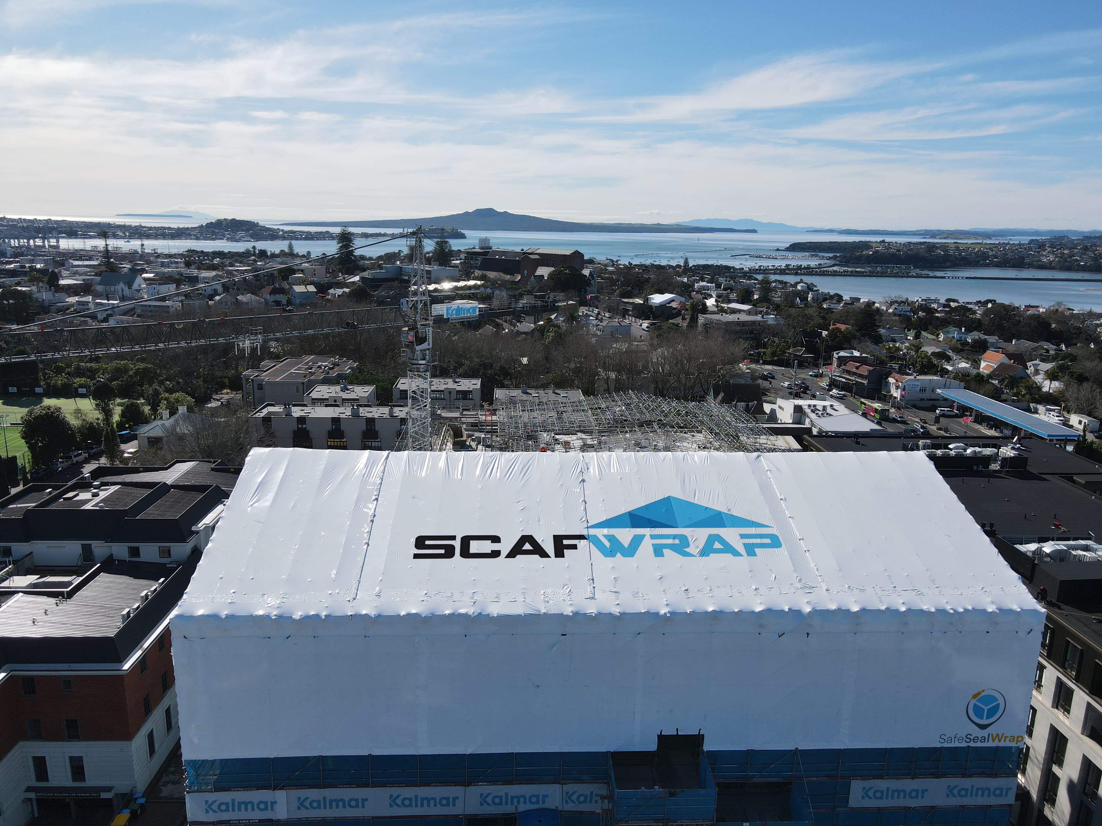Residential building recladding project with weatherproof shrink wrap in Auckland