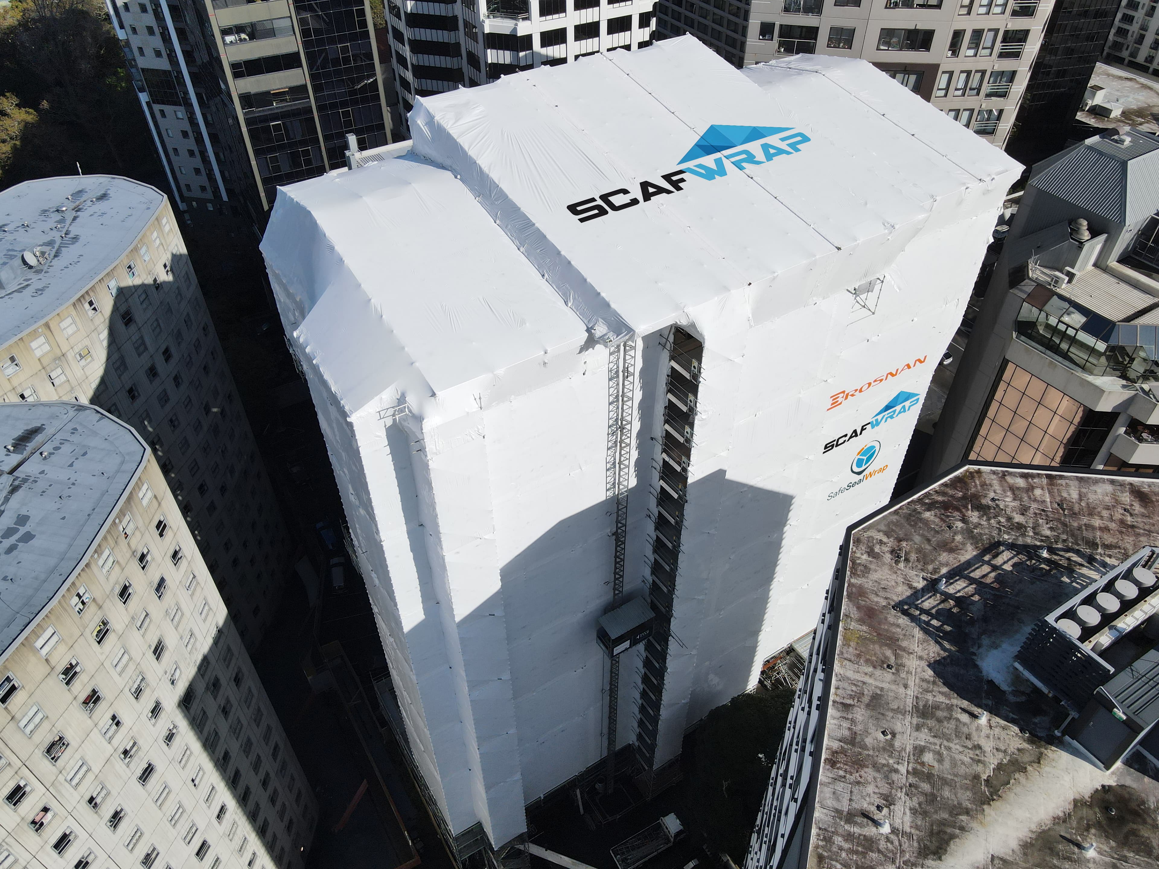 Residential building recladding project with weatherproof shrink wrap in Auckland